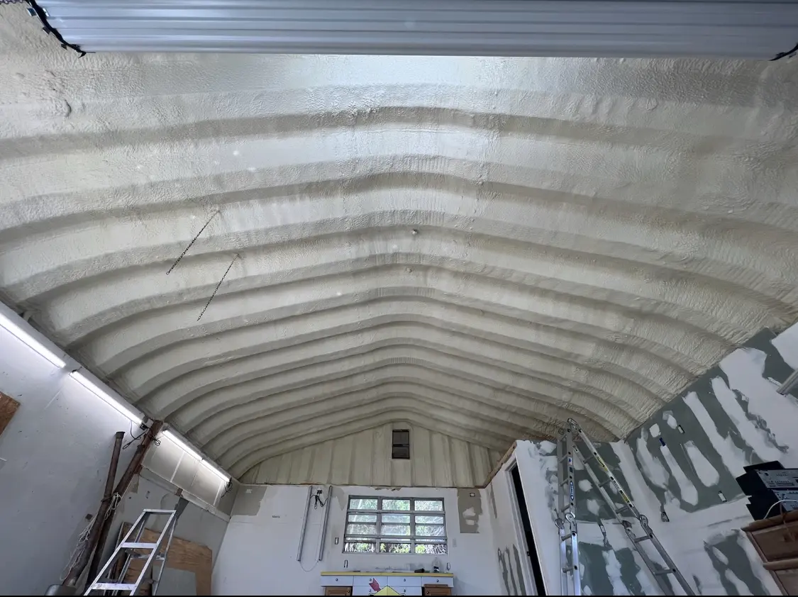 Spray polyurethane foam applied to the underside of a metal roof deck in Centerville